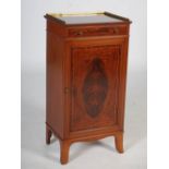 An Edwardian mahogany and boxwood lined music cabinet, the rectangular top with pierced brass