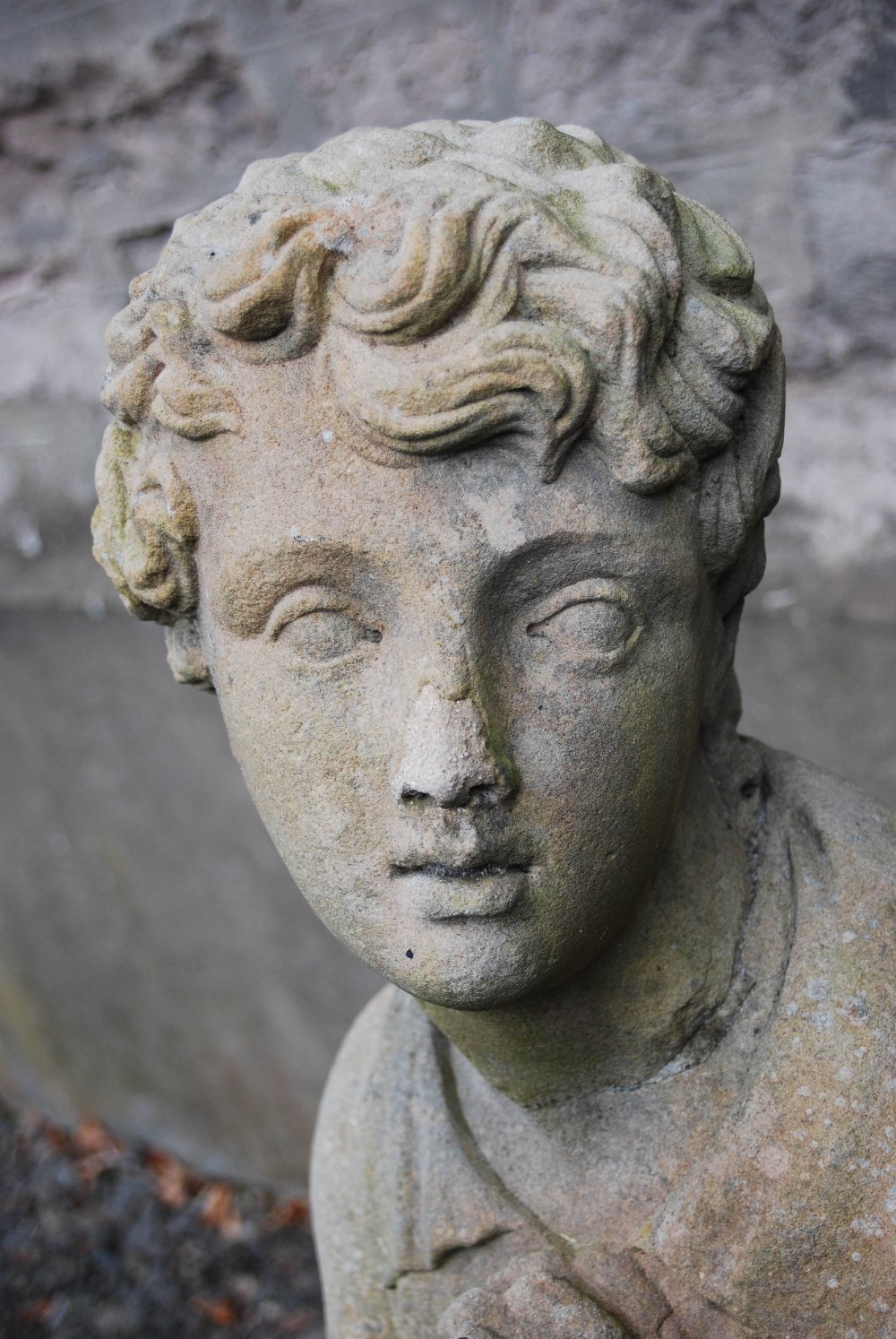 A 19th century carved stone figure of a boy, modelled standing with hands clasped, 132cm high - Image 3 of 9