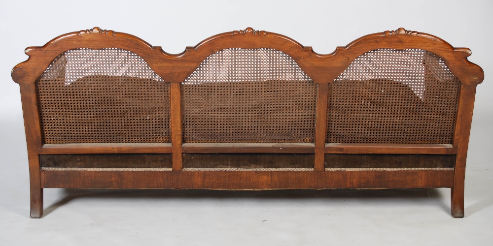 An Edwardian walnut three piece Bergere suite, comprising; three seat sofa and two armchairs, with - Image 3 of 7