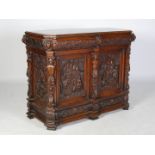 A 19th century Continental walnut Renaissance revival side cabinet, probably Italian, the