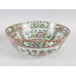 A Chinese porcelain famille rose Canton punch bowl, decorated with panels of figures divided by