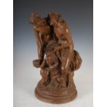 A terracotta figure group after Clodion, modelled with a bacchanalian faun, nymph and putti, on