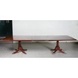 A 19th century mahogany twin pedestal dining table converting to two square snap top pedestal tables