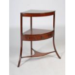 A George III mahogany and boxwood lined two tier corner wash stand, the lower tier fitted with a