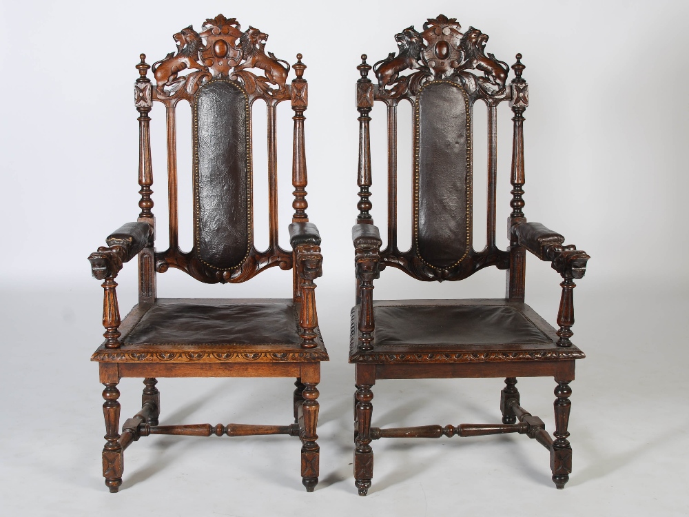 A pair of late Victorian oak armchairs, the top rails carved with shields flanked by lions above - Image 2 of 4
