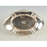 A George V silver oval shaped dish, London, 1911, makers mark of Hukin & Heath, engraved with