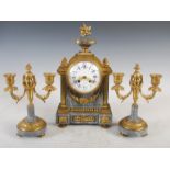 A late 19th century gilt metal mounted grey marble clock garniture, the mantel clock with convex