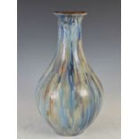 An early 20th century stoneware bottle vase, Guerin, with mottled blue glaze, incised marks, 47cm