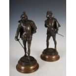 A pair of late 19th/early 20th century bronzed spelter figures of musketeers, modelled standing on