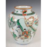 A Chinese porcelain Wucai vase, late 19th/early 20th century, decorated with officials and