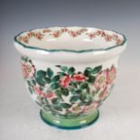 A Wemyss Stanley flower pot, decorated with dog roses within green line borders, impressed mark