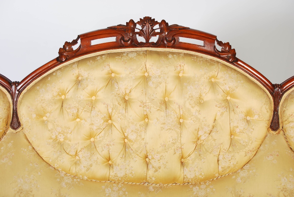 A Victorian mahogany sofa, the top rail carved and pierced with flowers and foliage above a back - Image 3 of 6