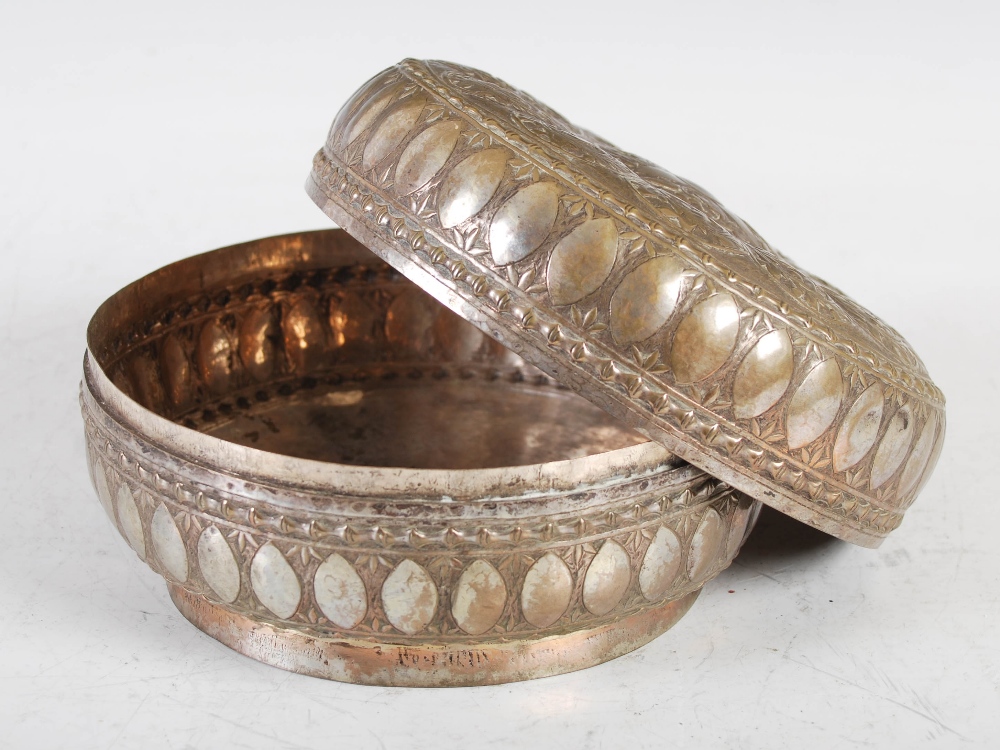 A late 19th century Indian white metal circular box and cover, decorated with embossed panels of - Image 3 of 4