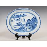 A Chinese porcelain blue and white oval shaped dish, Qing Dynasty, decorated with pine trees and