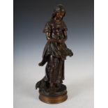 Emile Edmond Penot (1850-1932) - A bronze figure of a young girl, modelled standing with her hands