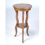 A late 19th/early 20th century French kingwood, rosewood and ormolu mounted two tier gueridon, the