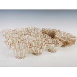 A set of twelve Venetian Latticino glass finger bowls and saucers, with gold coloured inclusions and