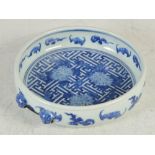 A Chinese porcelain blue and white dish, Qing Dynasty, decorated with chrysanthemum and bats on a