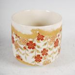 A Japanese Satsuma pottery bowl, with enamelled decoration of stylised flowers and foliage, 10cm