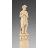 A late 19th century ivory page turner, the handled carved with a classical maiden, 32.5cm long