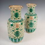 A pair of Chinese porcelain rouleau vases, Qing Dynasty, decorated with lotus scroll and shou