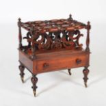A 19th century rosewood Canterbury, the rectangular top with four turned divisions above a single