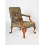 A late 19th century mahogany George II style Gainsborough armchair, the needlework upholstered back,
