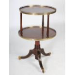 A late 19th century mahogany and gilt metal mounted two tier revolving dumb waiter, the upper tier