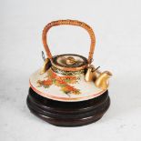 A Japanese Satsuma pottery miniature teapot and cover, Meiji Period, decorated with autumnal