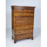 A George III mahogany and later secretaire tall chest, the moulded cornice and blind fret work