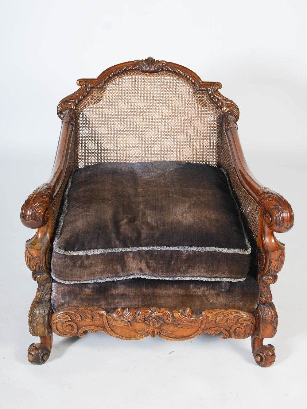 An Edwardian walnut three piece Bergere suite, comprising; three seat sofa and two armchairs, with - Image 4 of 7