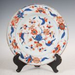 A Chinese porcelain Imari plate, Qing Dynasty, decorated with peony and chrysanthemum with scrolling