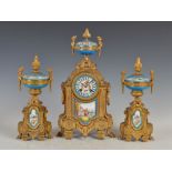 A late 19th century French ormolu and porcelain mounted clock garniture, the circular bleu celeste