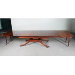 A 19th century mahogany extending pedestal dining table, the rectangular top enclosing five