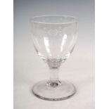 An oversized 19th century glass rummer, with wheel cut border of oval shaped medallions bearing