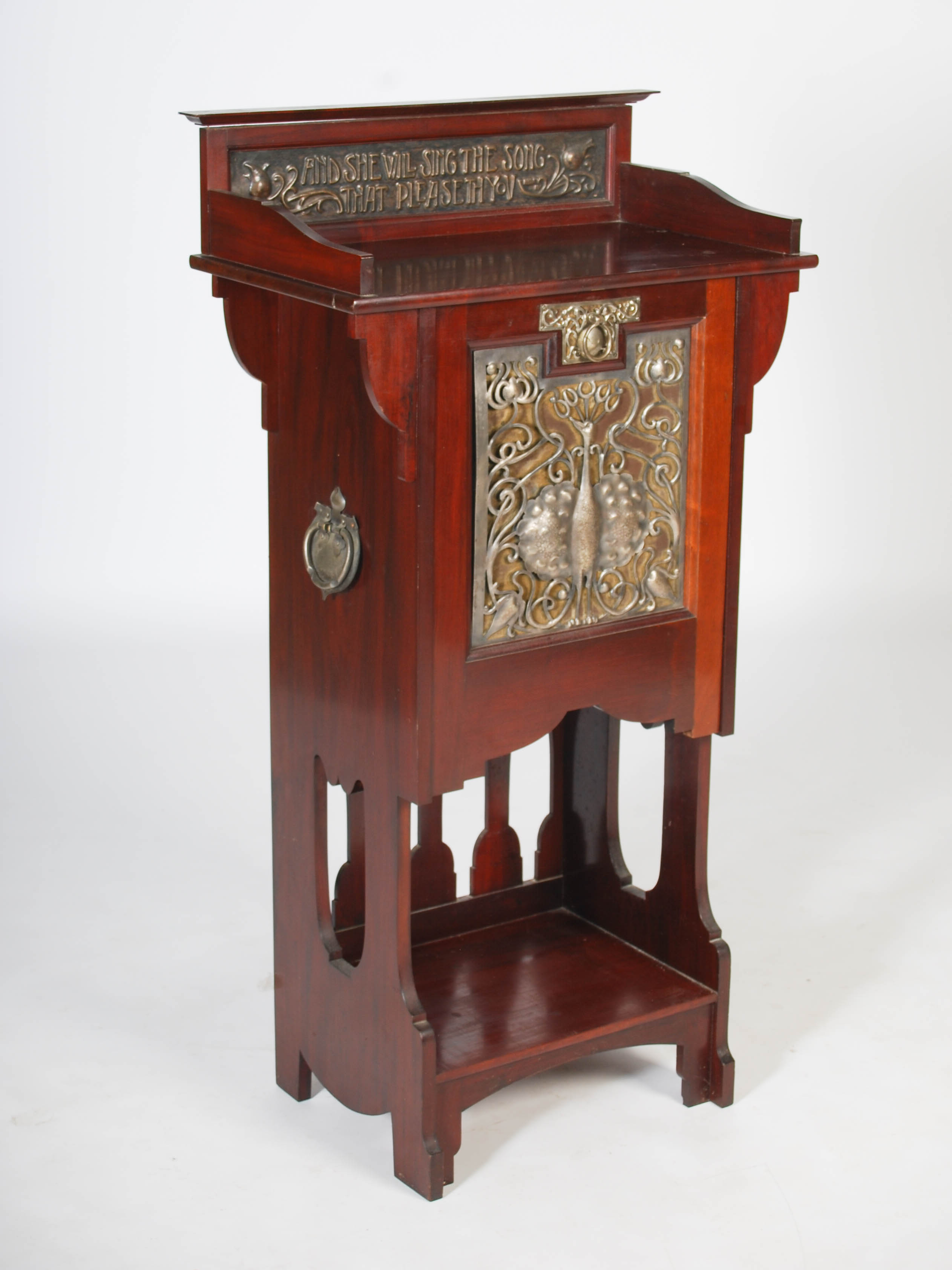 An early 20th century Arts & Crafts mahogany, white metal and copper mounted music cabinet, the