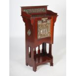 An early 20th century Arts & Crafts mahogany, white metal and copper mounted music cabinet, the