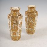 A pair of Japanese Satsuma pottery hexagonal shaped vases, decorated with panels of warriors divided