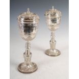 A pair of Edwardian Irish silver Assize goblets and covers, Dublin, 1911, makers mark of EJ for