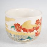 A Japanese Satsuma pottery bowl, with enamelled decoration of seascape, islands and foliage, 11cm