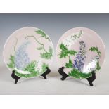A pair of Japanese pale pink ground porcelain plates, late 19th/early 20th century, decorated in the