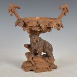 A late 19th century Swiss carved wood bear table centrepiece, Egger & Brugger, Interlaken, with