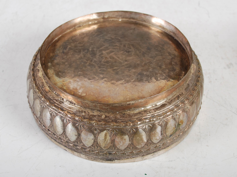 A late 19th century Indian white metal circular box and cover, decorated with embossed panels of - Image 4 of 4