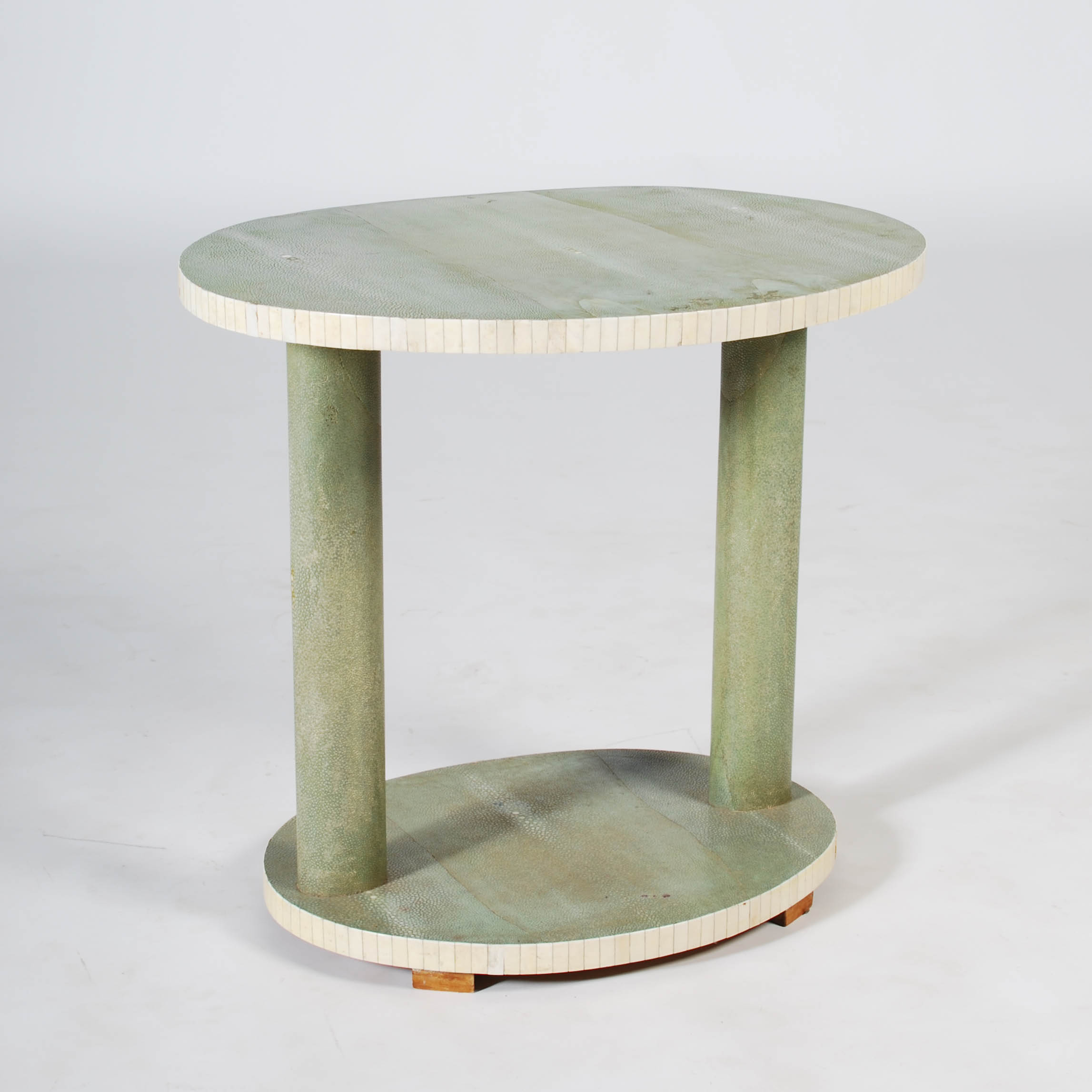 An early 20th century Art Deco shagreen and ivory occasional table, the oval top raised on two