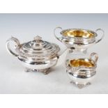 A George III silver three piece tea set, Edinburgh, 1819, the teapot with the makers mark M & R, the