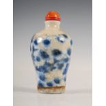 A Chinese porcelain crackle glazed blue and white snuff bottle, Meiping shaped, decorated with