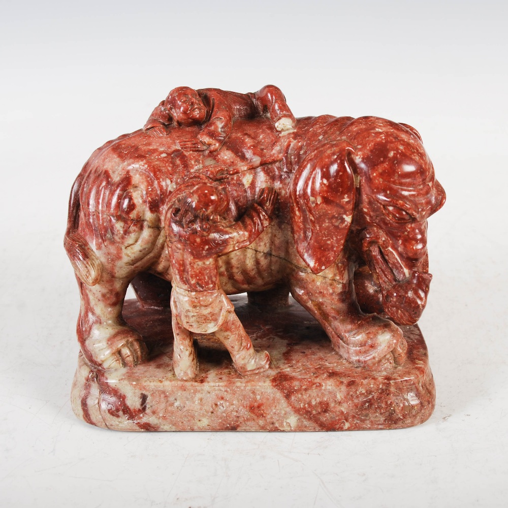 A pair of Chinese soapstone elephants, late Qing Dynasty, carved standing with pairs of attendant - Image 2 of 7