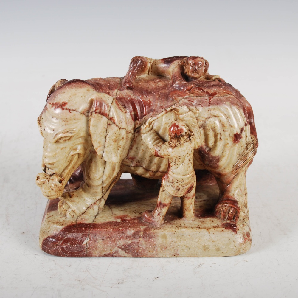 A pair of Chinese soapstone elephants, late Qing Dynasty, carved standing with pairs of attendant - Image 5 of 7