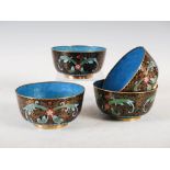 A set of four Chinese cloisonne black ground bowls, decorated with flowers and scrolling foliage,
