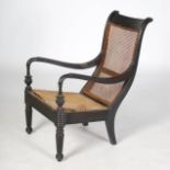 A 19th century Anglo Indian calamander planters armchair, the top rail with horizontal reeded detail